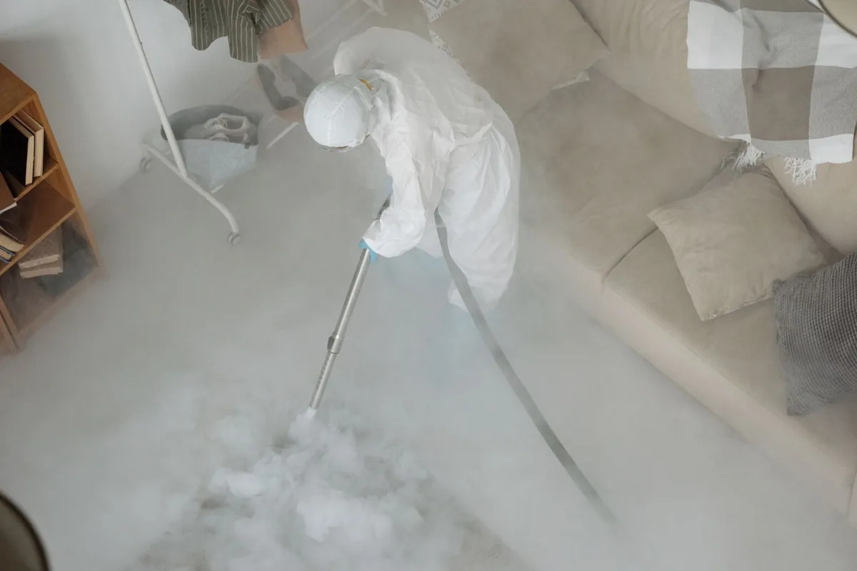 Biohazard cleanup technician in protective equipment, Seacliff, San Francisco, CA